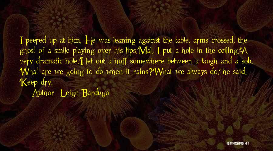 Leigh Bardugo Quotes: I Peered Up At Him. He Was Leaning Against The Table, Arms Crossed, The Ghost Of A Smile Playing Over