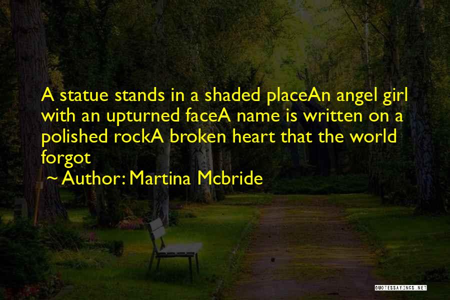 Martina Mcbride Quotes: A Statue Stands In A Shaded Placean Angel Girl With An Upturned Facea Name Is Written On A Polished Rocka