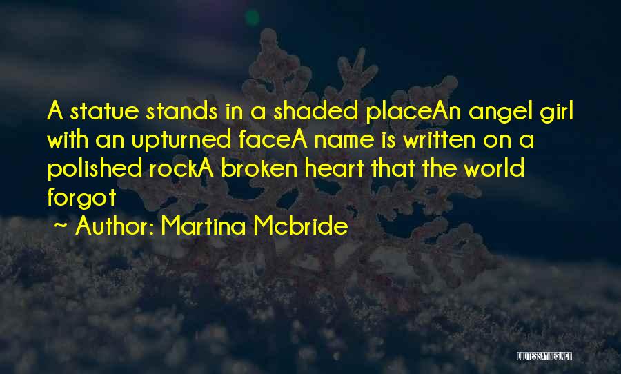 Martina Mcbride Quotes: A Statue Stands In A Shaded Placean Angel Girl With An Upturned Facea Name Is Written On A Polished Rocka