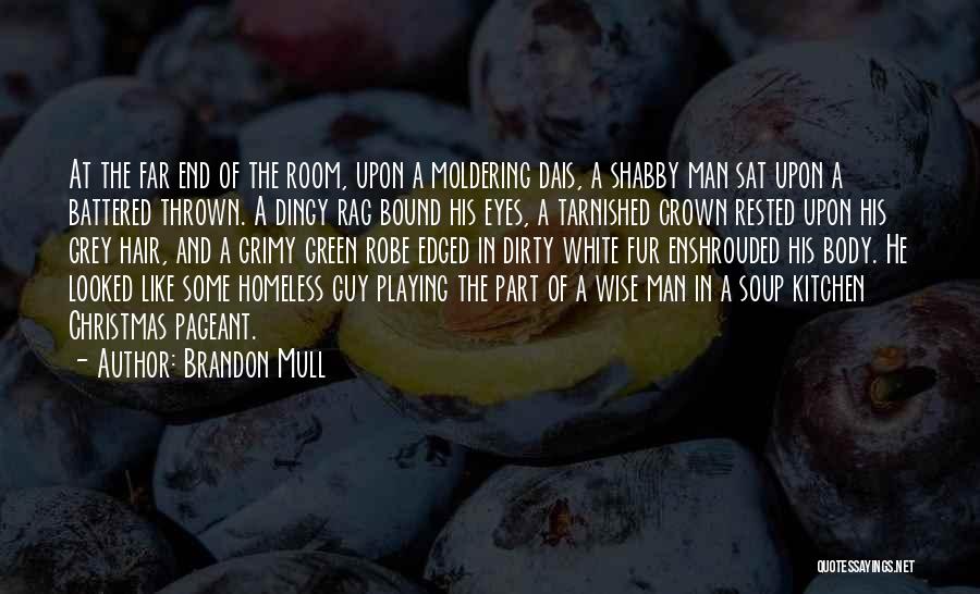 Brandon Mull Quotes: At The Far End Of The Room, Upon A Moldering Dais, A Shabby Man Sat Upon A Battered Thrown. A