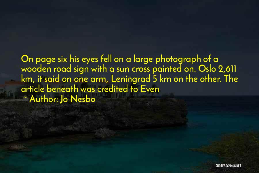 Jo Nesbo Quotes: On Page Six His Eyes Fell On A Large Photograph Of A Wooden Road Sign With A Sun Cross Painted