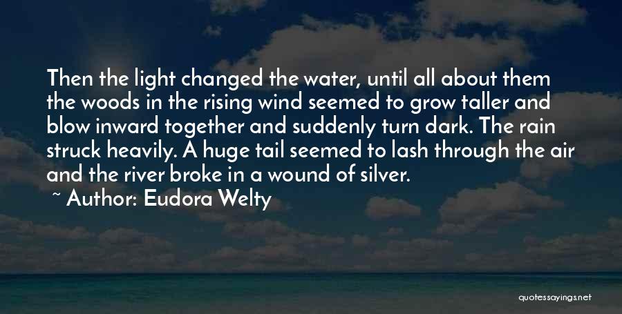 Eudora Welty Quotes: Then The Light Changed The Water, Until All About Them The Woods In The Rising Wind Seemed To Grow Taller