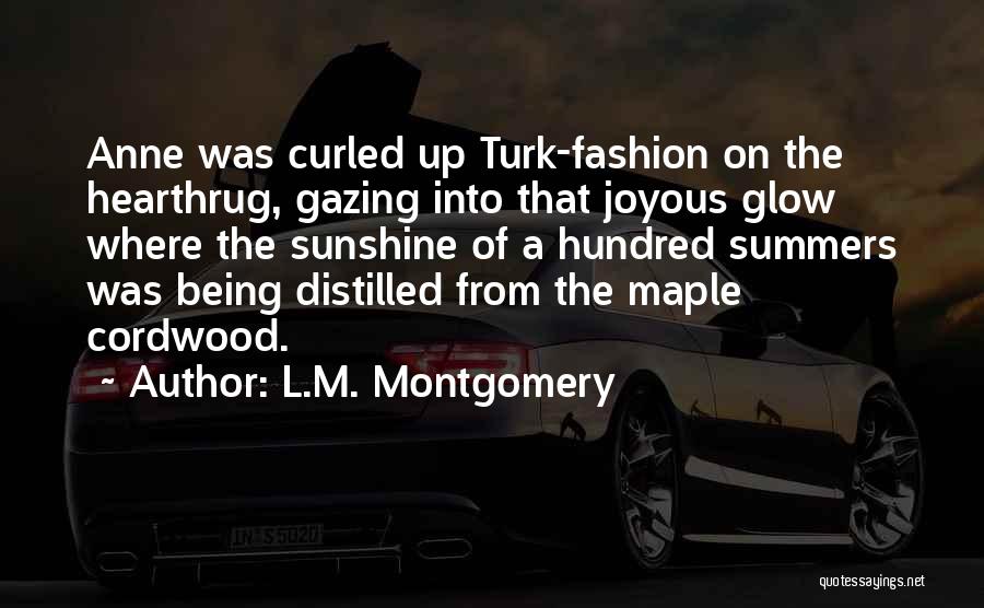 L.M. Montgomery Quotes: Anne Was Curled Up Turk-fashion On The Hearthrug, Gazing Into That Joyous Glow Where The Sunshine Of A Hundred Summers