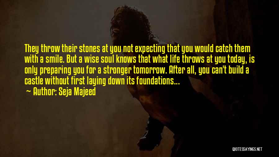 Seja Majeed Quotes: They Throw Their Stones At You Not Expecting That You Would Catch Them With A Smile. But A Wise Soul