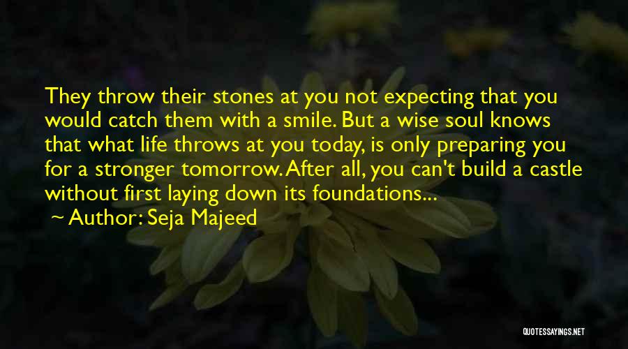 Seja Majeed Quotes: They Throw Their Stones At You Not Expecting That You Would Catch Them With A Smile. But A Wise Soul