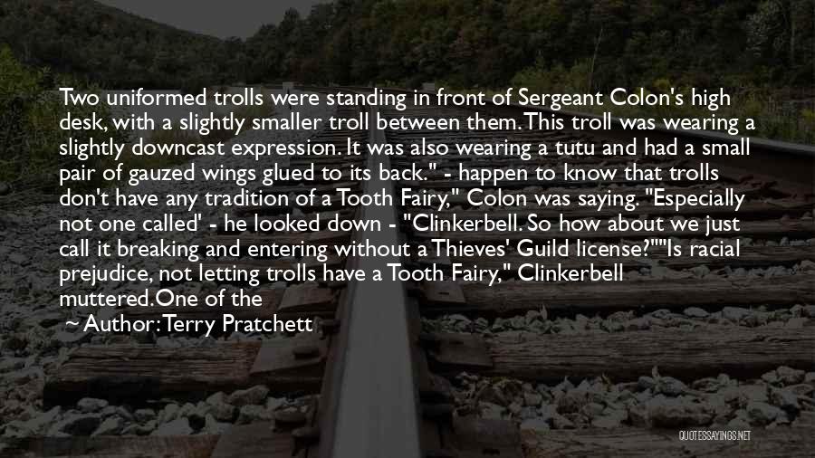 Terry Pratchett Quotes: Two Uniformed Trolls Were Standing In Front Of Sergeant Colon's High Desk, With A Slightly Smaller Troll Between Them. This