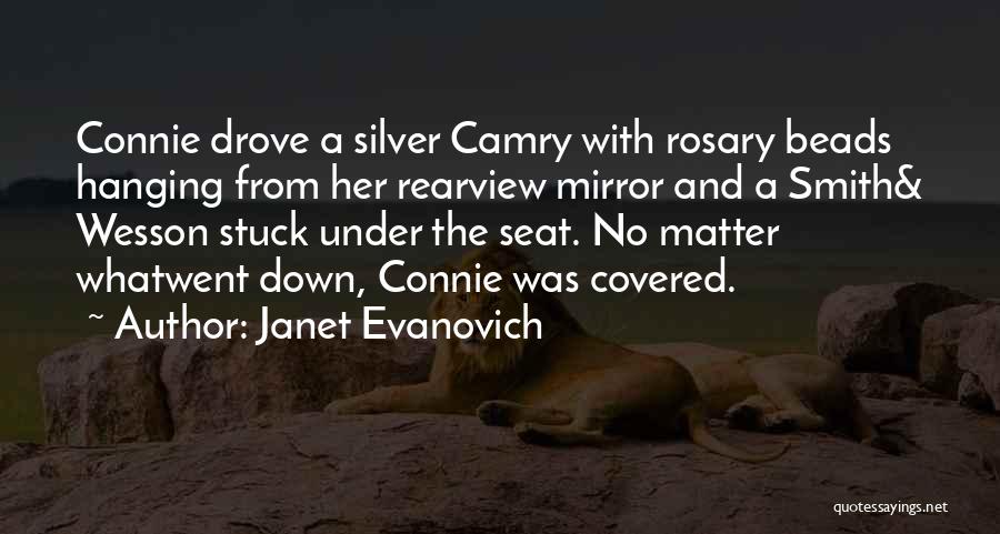 Janet Evanovich Quotes: Connie Drove A Silver Camry With Rosary Beads Hanging From Her Rearview Mirror And A Smith& Wesson Stuck Under The