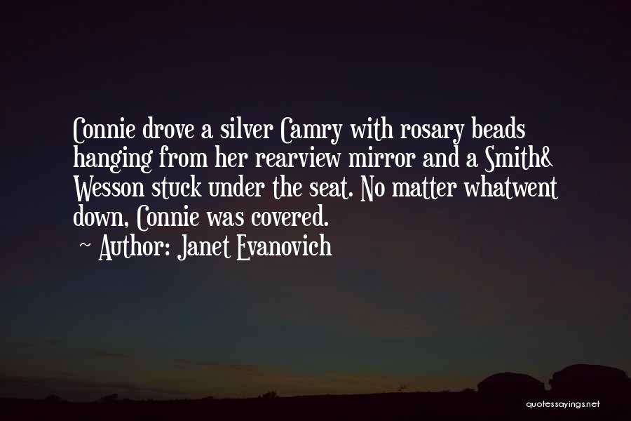 Janet Evanovich Quotes: Connie Drove A Silver Camry With Rosary Beads Hanging From Her Rearview Mirror And A Smith& Wesson Stuck Under The