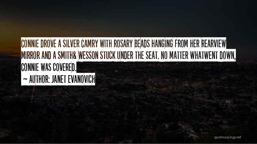 Janet Evanovich Quotes: Connie Drove A Silver Camry With Rosary Beads Hanging From Her Rearview Mirror And A Smith& Wesson Stuck Under The