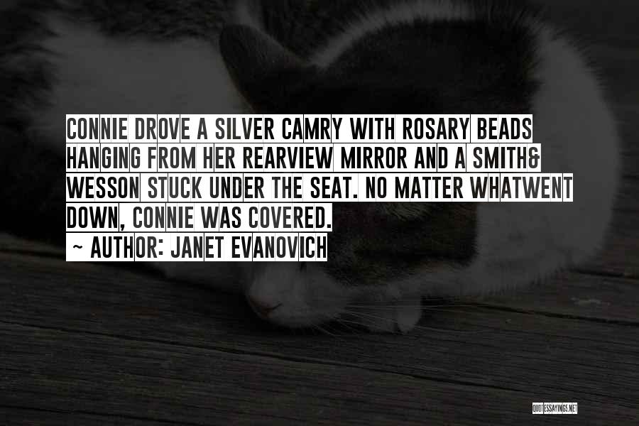 Janet Evanovich Quotes: Connie Drove A Silver Camry With Rosary Beads Hanging From Her Rearview Mirror And A Smith& Wesson Stuck Under The