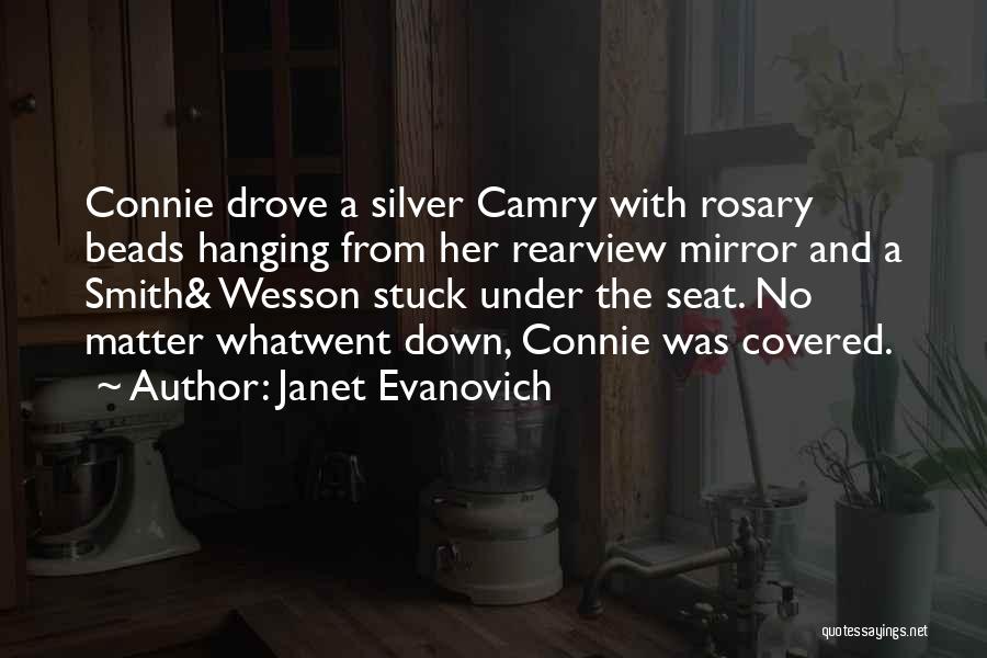 Janet Evanovich Quotes: Connie Drove A Silver Camry With Rosary Beads Hanging From Her Rearview Mirror And A Smith& Wesson Stuck Under The