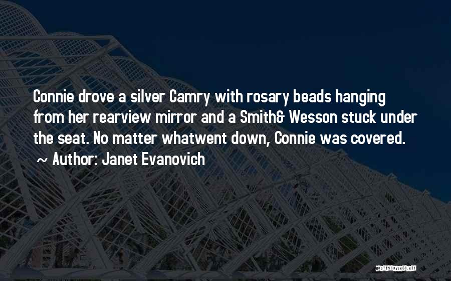 Janet Evanovich Quotes: Connie Drove A Silver Camry With Rosary Beads Hanging From Her Rearview Mirror And A Smith& Wesson Stuck Under The