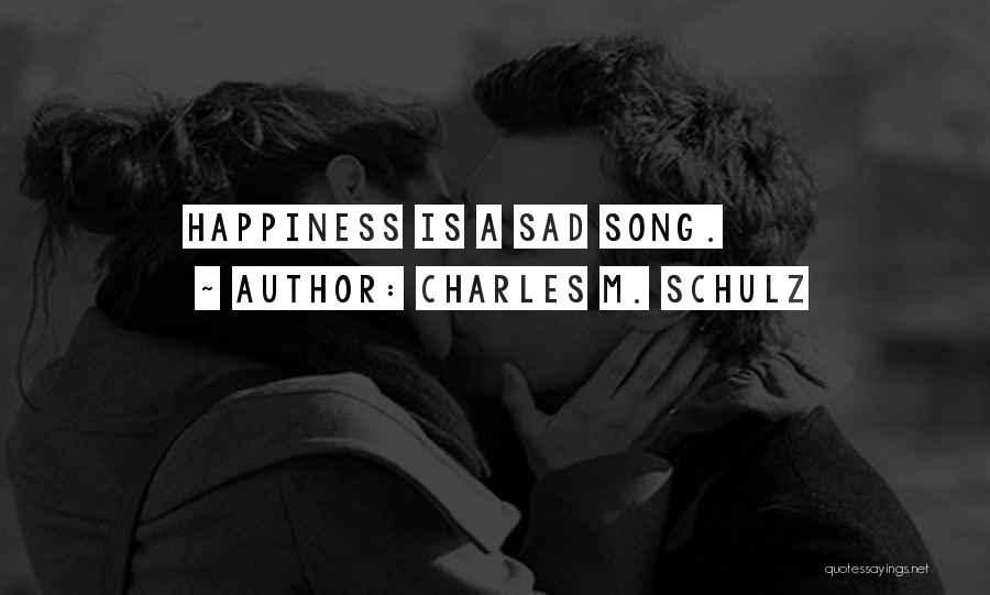 Charles M. Schulz Quotes: Happiness Is A Sad Song.
