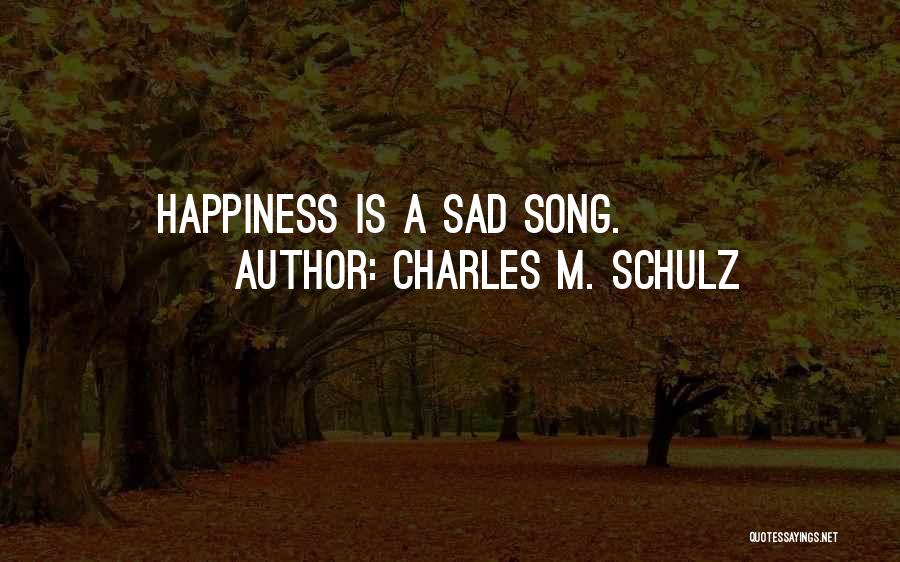 Charles M. Schulz Quotes: Happiness Is A Sad Song.