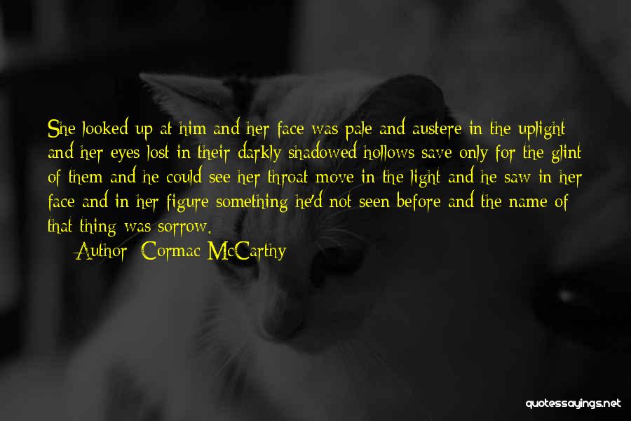 Cormac McCarthy Quotes: She Looked Up At Him And Her Face Was Pale And Austere In The Uplight And Her Eyes Lost In