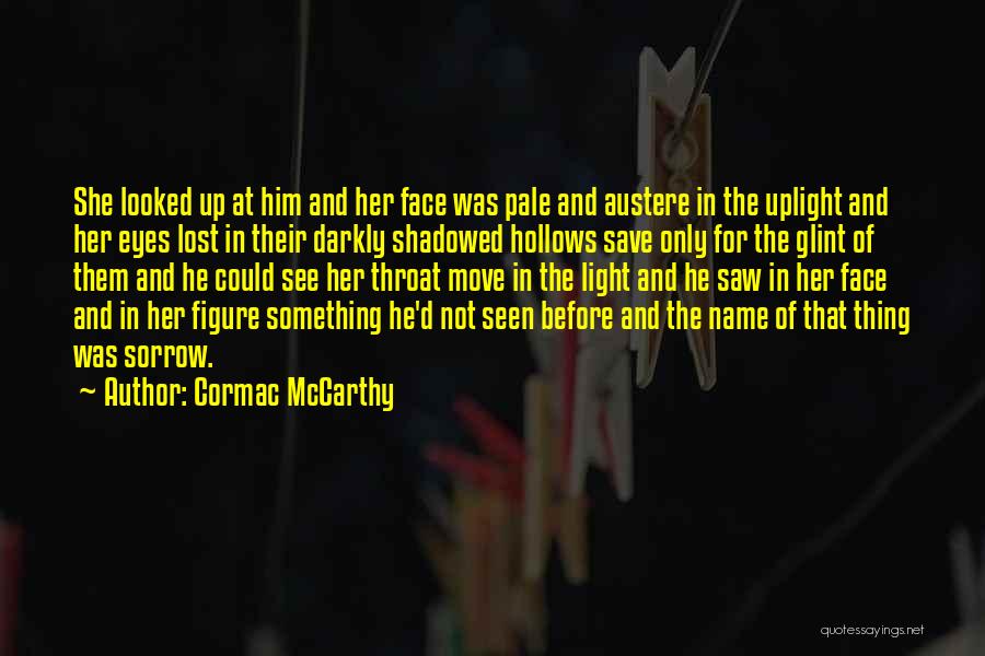 Cormac McCarthy Quotes: She Looked Up At Him And Her Face Was Pale And Austere In The Uplight And Her Eyes Lost In