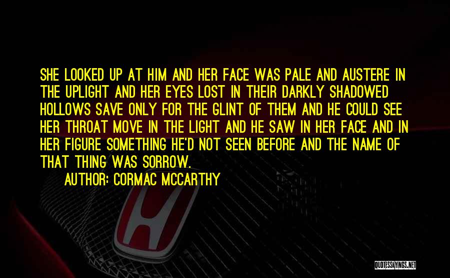 Cormac McCarthy Quotes: She Looked Up At Him And Her Face Was Pale And Austere In The Uplight And Her Eyes Lost In