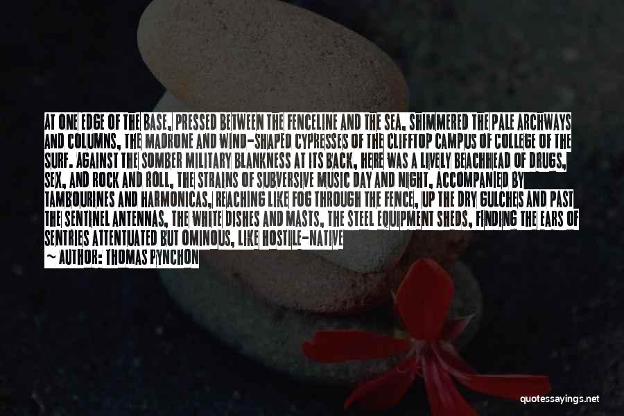 Thomas Pynchon Quotes: At One Edge Of The Base, Pressed Between The Fenceline And The Sea, Shimmered The Pale Archways And Columns, The