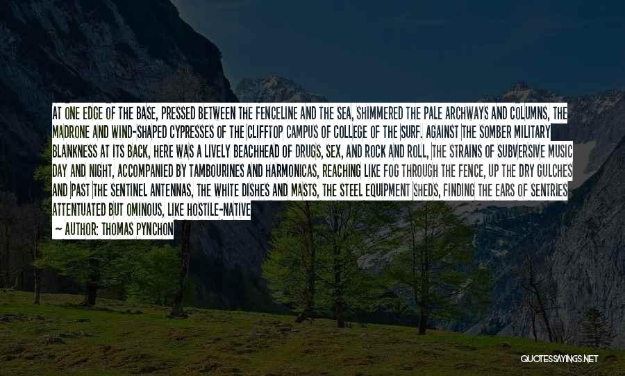 Thomas Pynchon Quotes: At One Edge Of The Base, Pressed Between The Fenceline And The Sea, Shimmered The Pale Archways And Columns, The