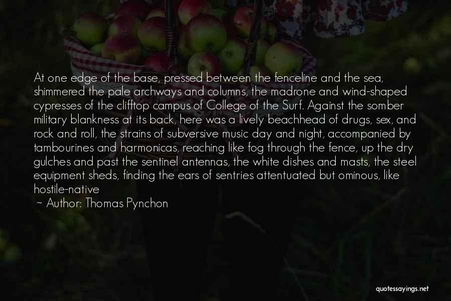 Thomas Pynchon Quotes: At One Edge Of The Base, Pressed Between The Fenceline And The Sea, Shimmered The Pale Archways And Columns, The