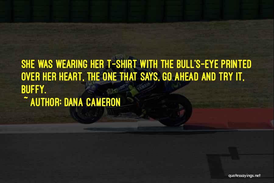 Dana Cameron Quotes: She Was Wearing Her T-shirt With The Bull's-eye Printed Over Her Heart, The One That Says, Go Ahead And Try
