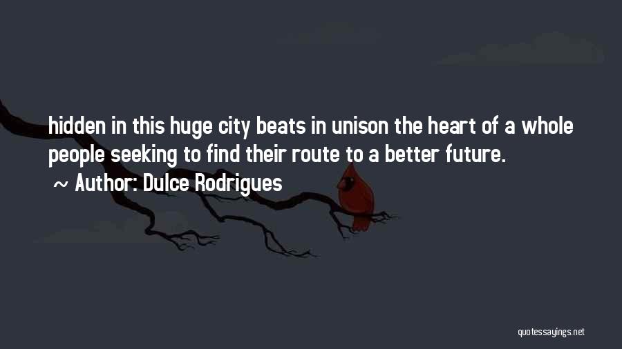 Dulce Rodrigues Quotes: Hidden In This Huge City Beats In Unison The Heart Of A Whole People Seeking To Find Their Route To