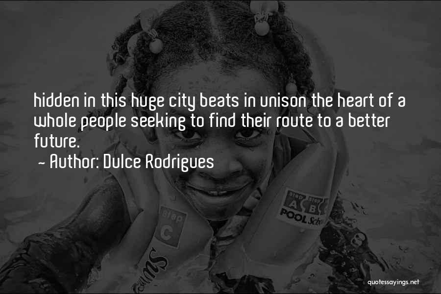 Dulce Rodrigues Quotes: Hidden In This Huge City Beats In Unison The Heart Of A Whole People Seeking To Find Their Route To