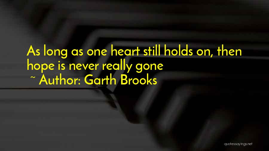 He Holds My Heart Quotes By Garth Brooks